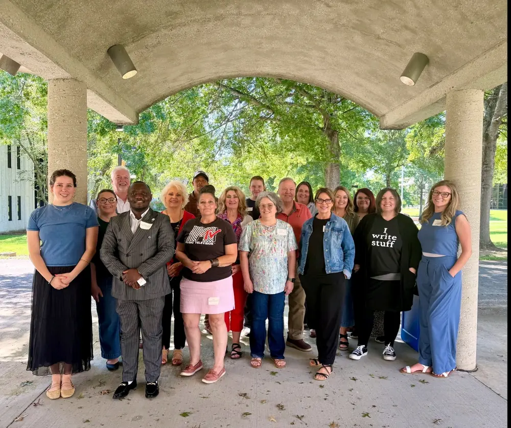 Renee Parsons with a Grant Ready Kentucky class of nonprofit leaders under a campus pavilion